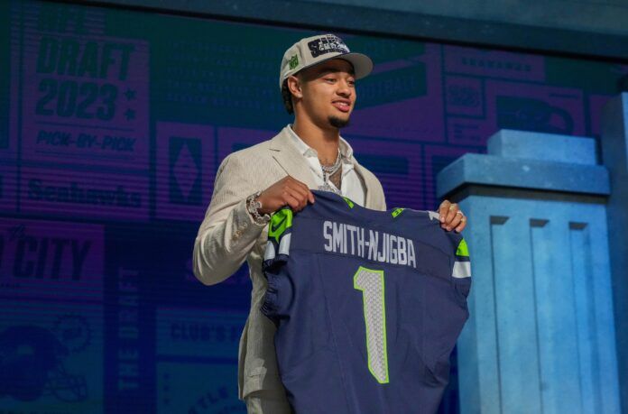 Jaxon Smith-Njigba on stage after being selected by the Seattle Seahawks twentieth overall in the first round of the 2023 NFL Draft at Union Station.