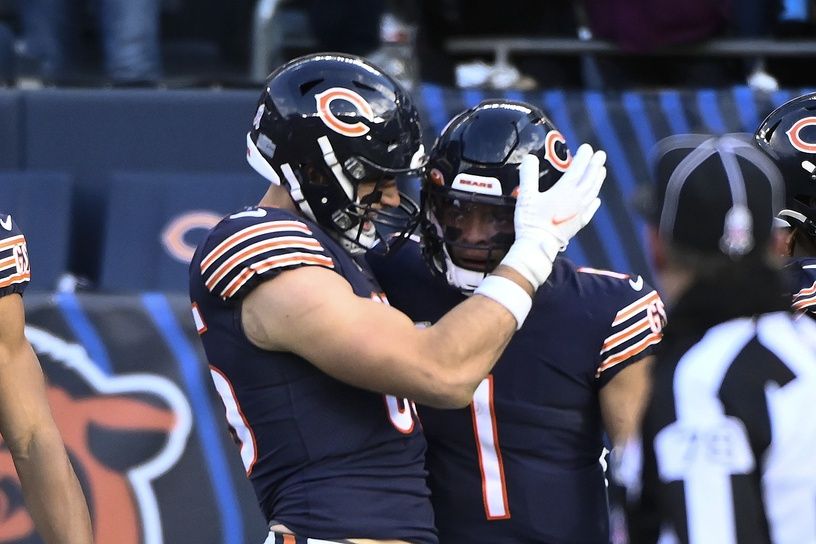 Chicago Bears QB Justin Fields (1) and TE Cole Kmet (85) celebrate after a touchdown.