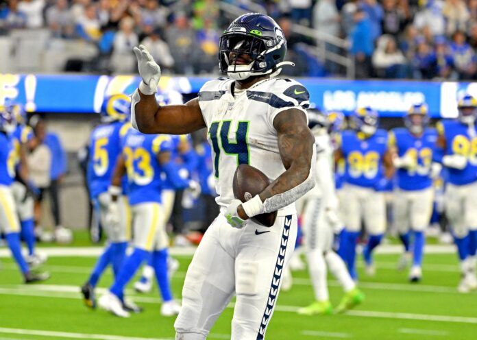 DK Metcalf (14) celebrates after a touchdown in the fourth quarter against the Los Angeles Rams at SoFi Stadium.