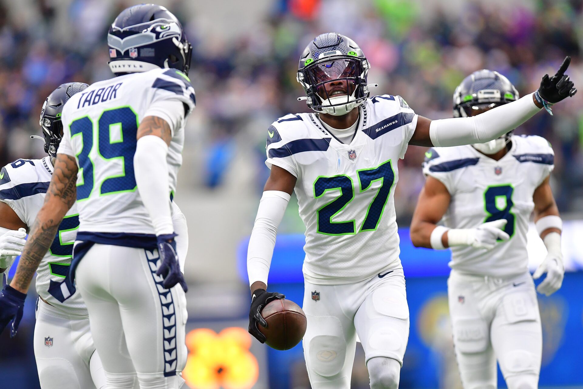 Seattle Seahawks CB Tariq Woolen (27) celebrates after a turnover.