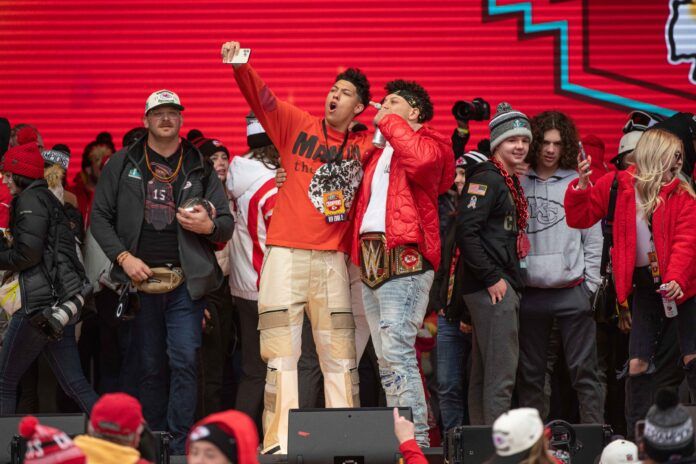 Kansas City Chiefs QB Patrick Mahomes and his brother, Jackson, celebrate the team's Super Bowl victory at the parade in Kansas City.