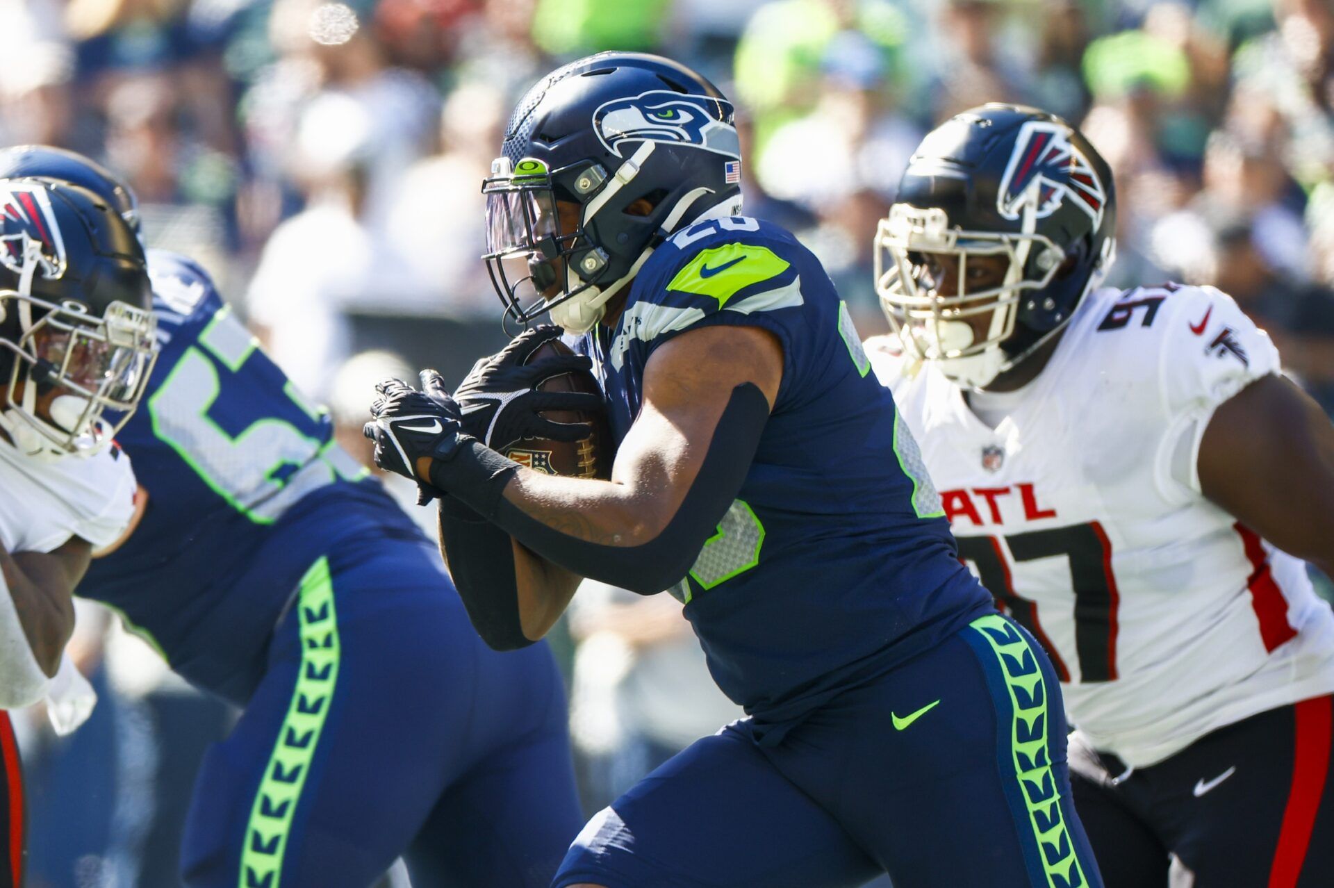 Running back Rashaad Penny (20) rushes against the Atlanta Falcons as a member of the Seattle Seahawks.