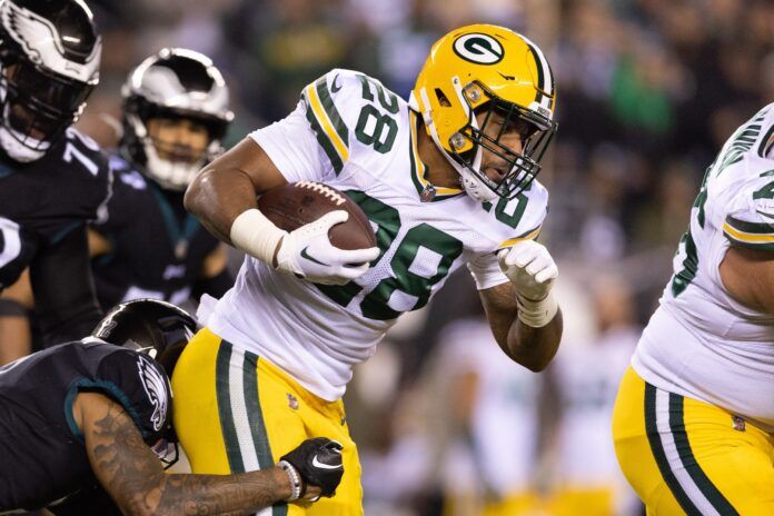 AJ Dillon (28) runs with the ball against the Philadelphia Eagles during the second quarter at Lincoln Financial Field.