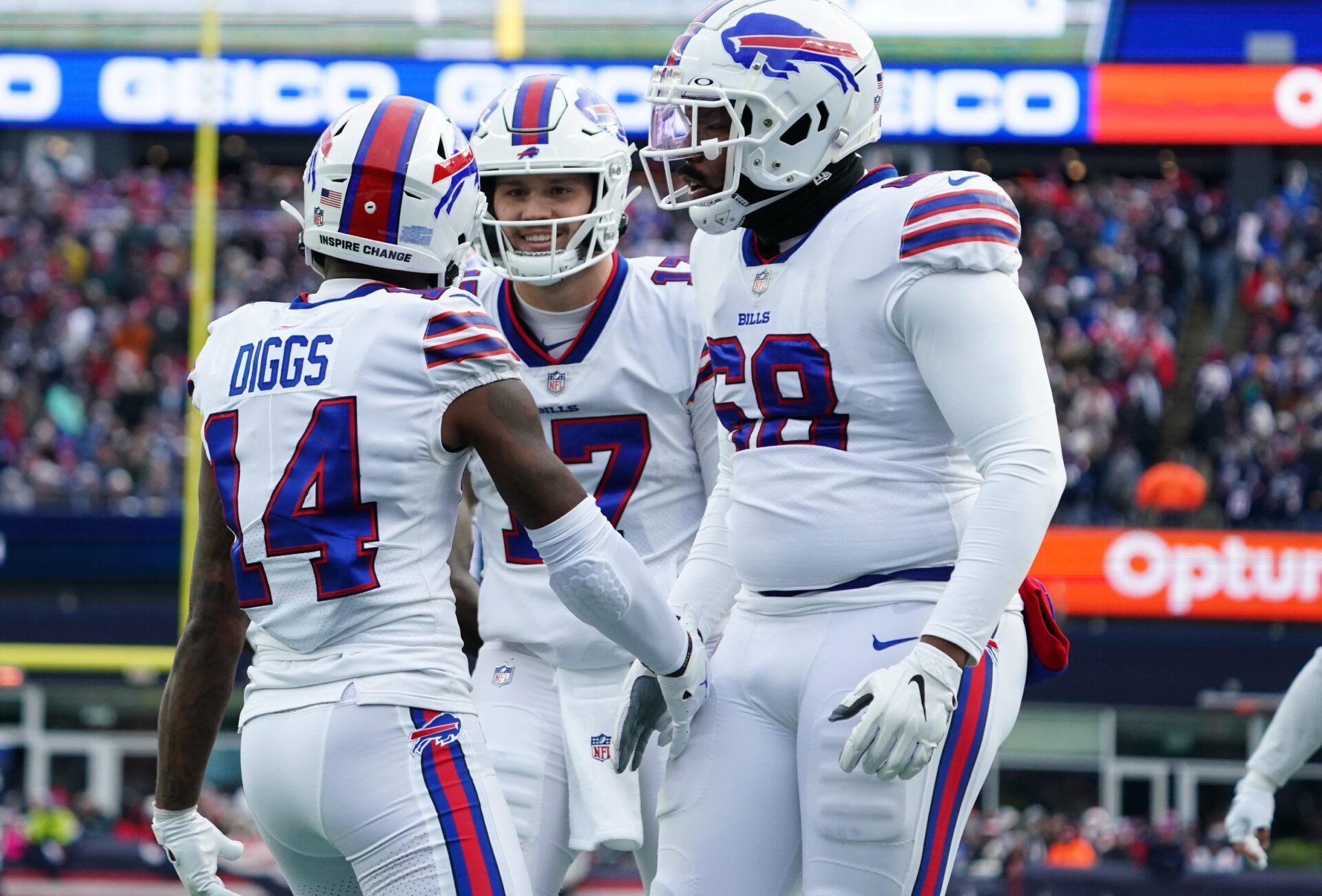 Buffalo Bills QB Josh Allen (17) and WR Stefon Diggs (14) celebrate after a touchdown against New England.