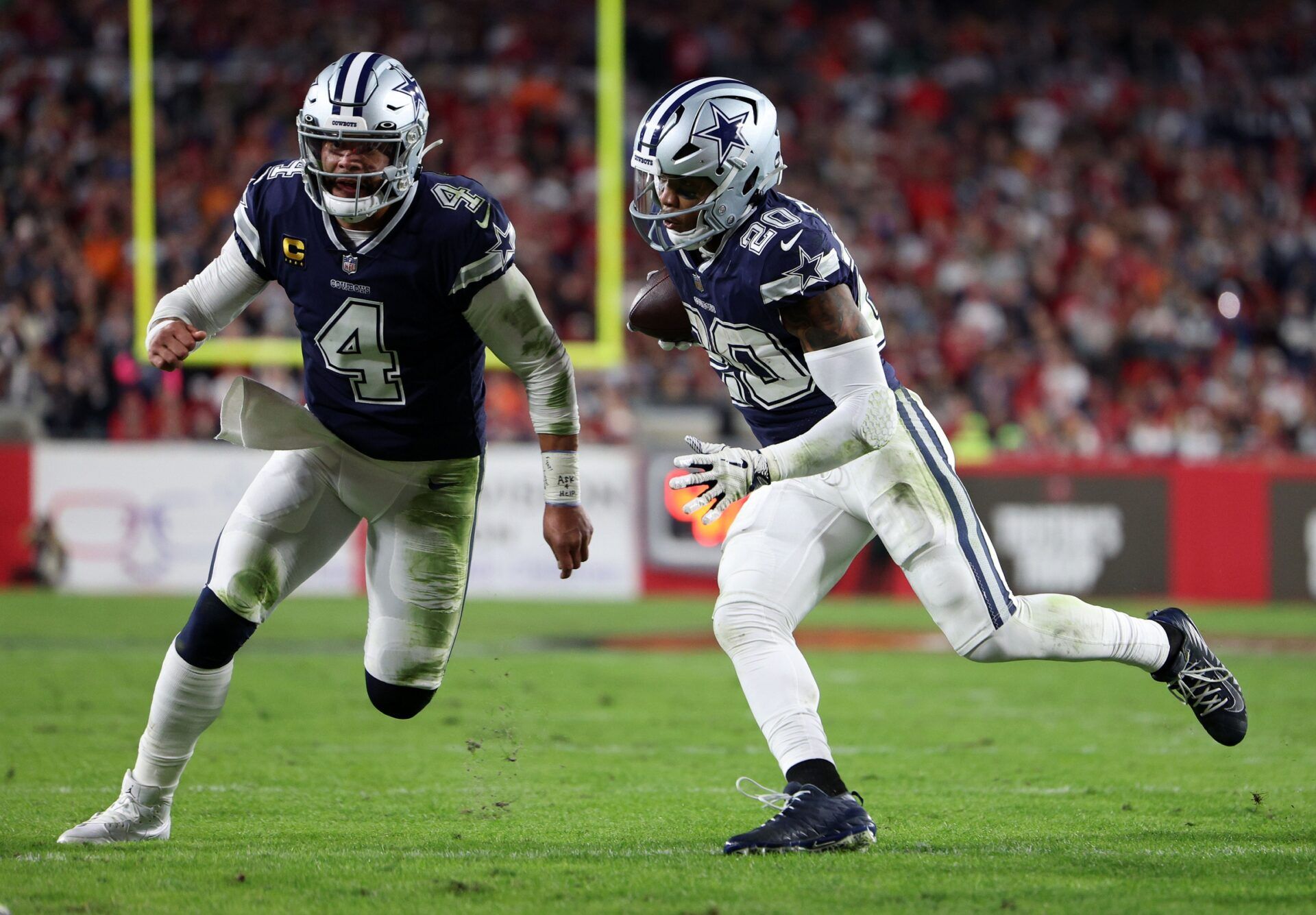 Tony Pollard (20) rushes the ball against the Tampa Bay Buccaneers in the first half during the wild card game at Raymond James Stadium.