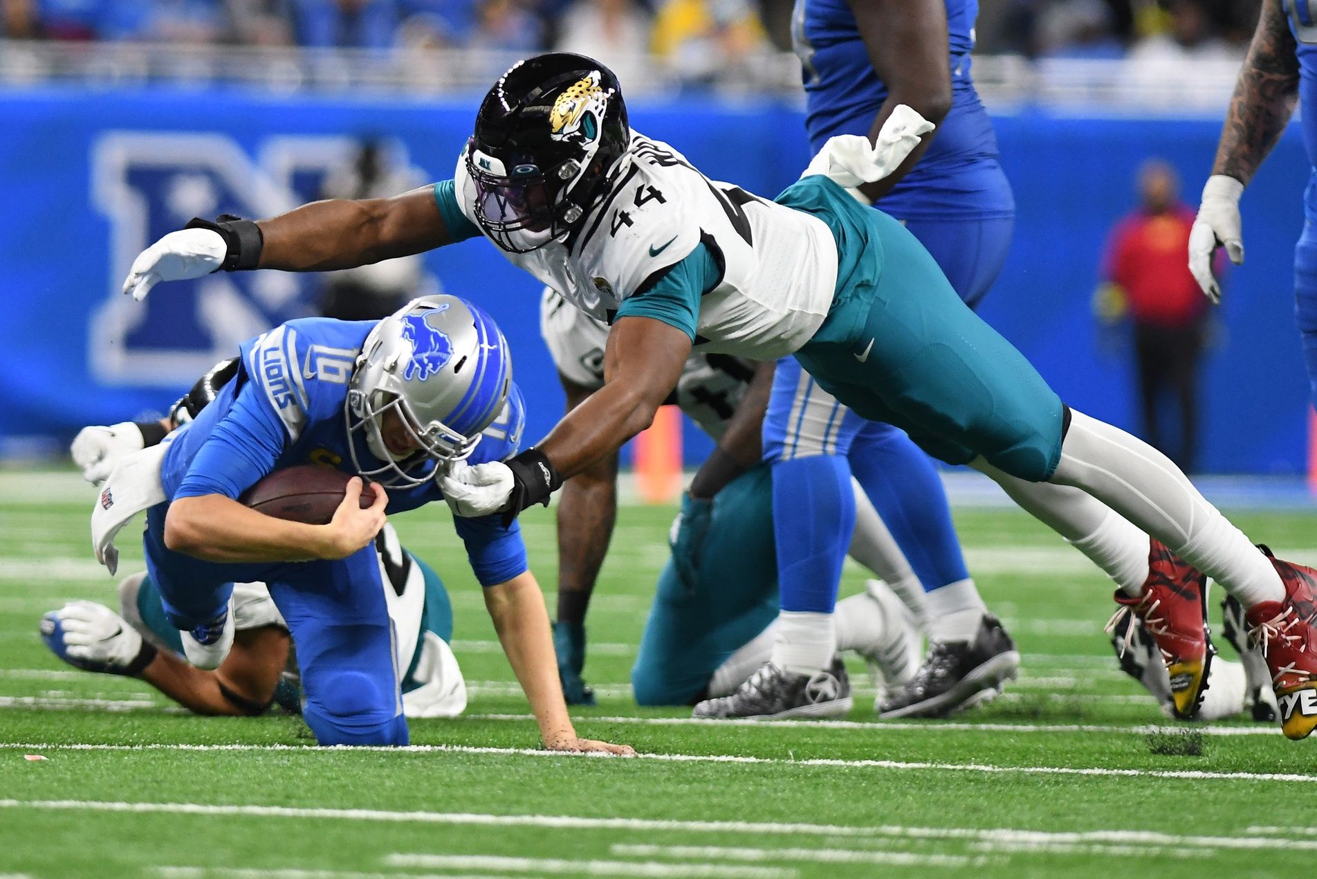 Jacksonville Jaguars LB Travon Walker (44) sacks Detroit Lions QB Jared Goff (16).