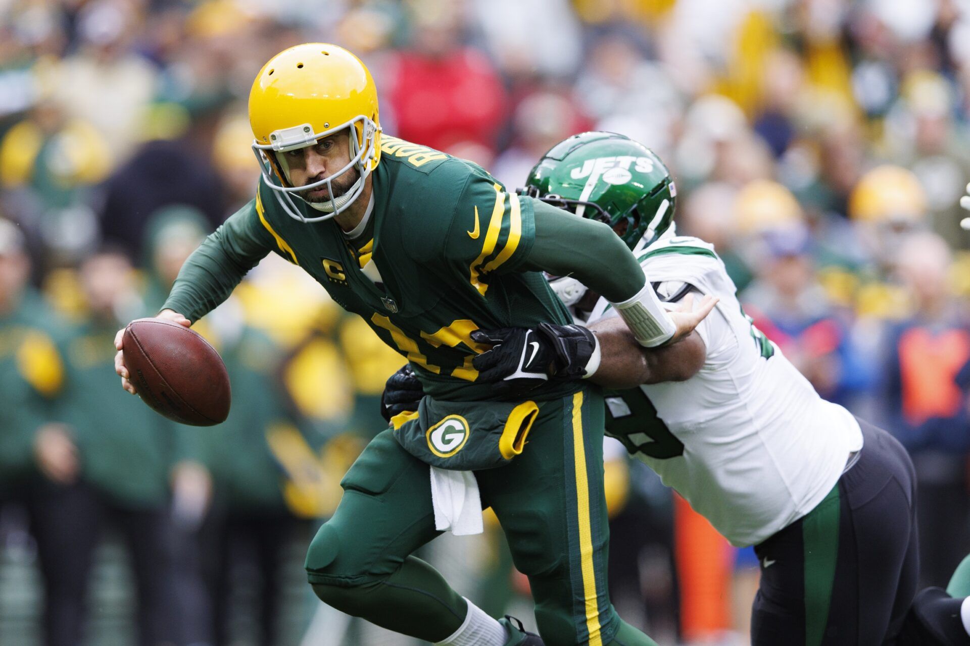 New York Jets DT Quinnen Williams (95) attempts to sack now-teammate Aaron Rodgers (12) when he was a member of the Green Bay Packers.