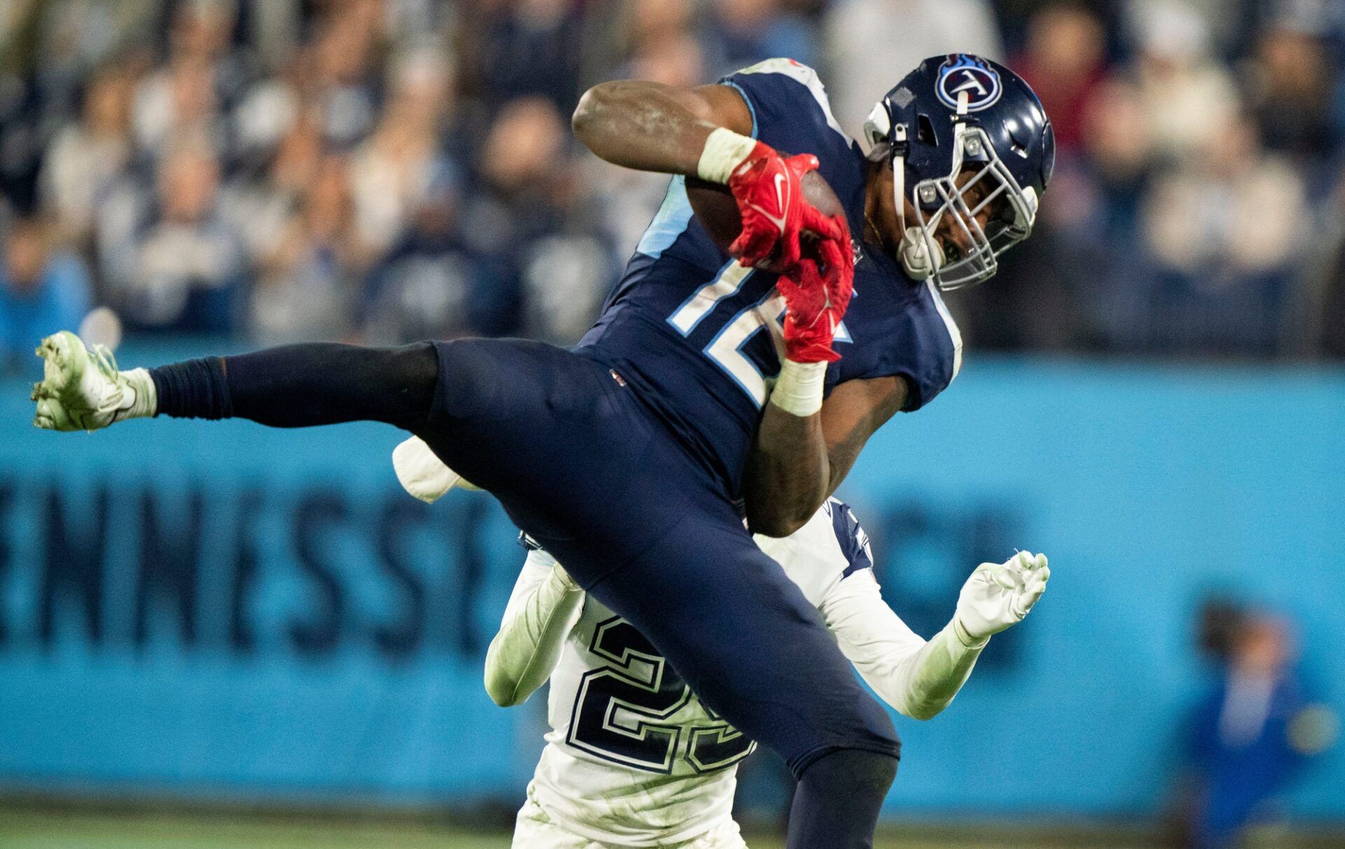 Treylon Burks (16) pulls in a catch over Dallas Cowboys cornerback C.J. Goodwin (29) during the fourth quarter.