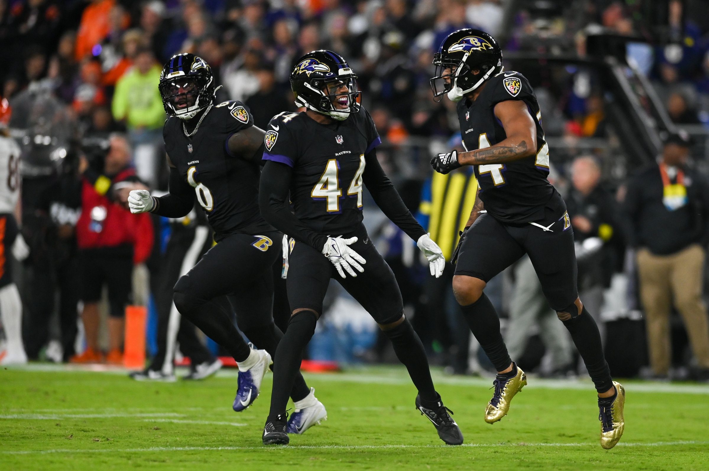 Marcus Peters (24) and cornerback Marlon Humphrey (44) celebrate after stoping Cincinnati Bengals on third down during the first quarter.