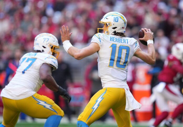 Los Angeles Chargers QB Justin Herbert (10) throws a pass in the game against Arizona.