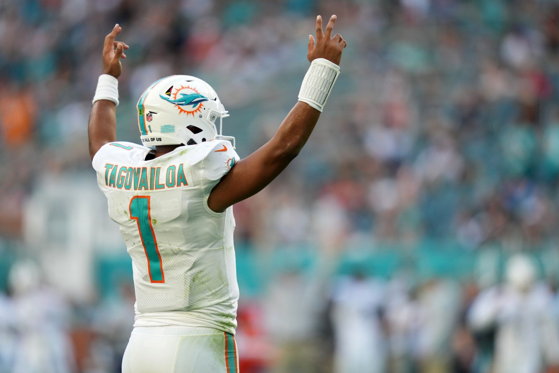 Tua Tagovailoa (1) celebrates the touchdown run of running back Myles Gaskin (not pictured) during the second half against the Carolina Panthers at Hard Rock Stadium.