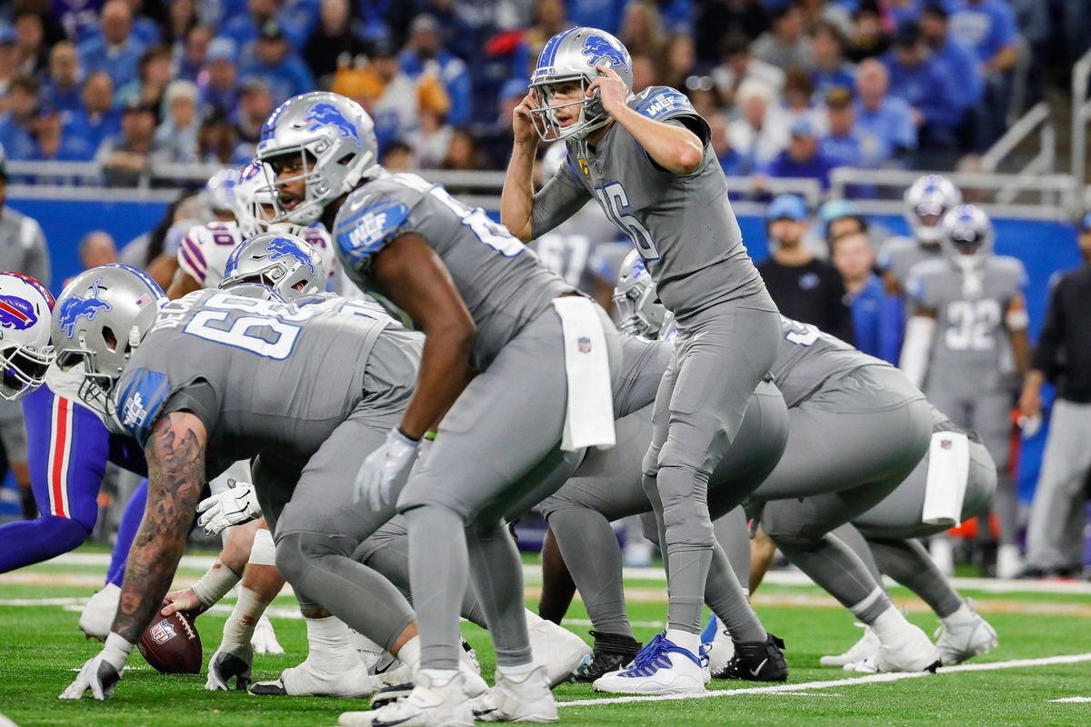 Detroit Lions QB Jared Goff (16) signals prior to an offensive play.