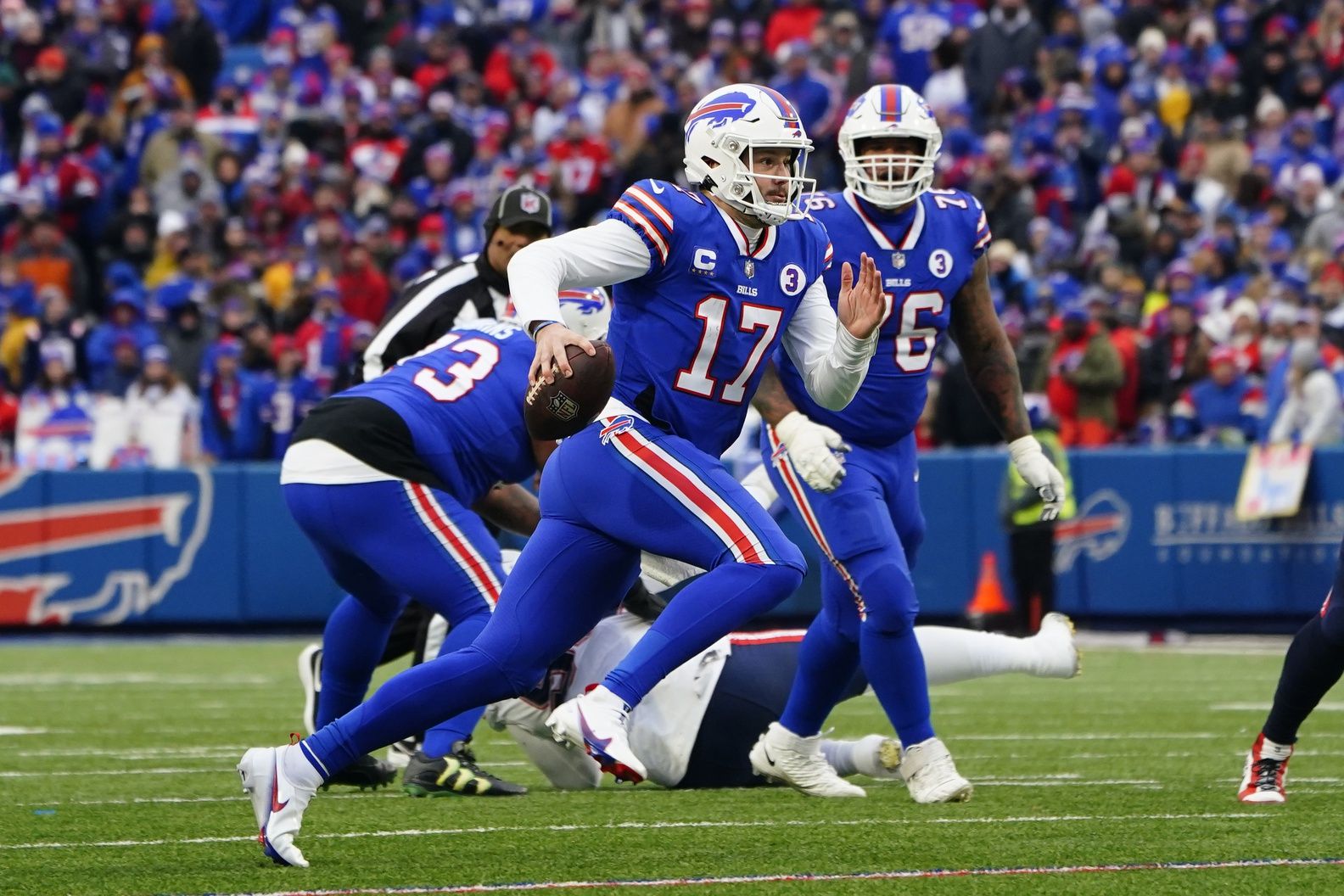 Buffalo Bills quarterback Josh Allen (17) runs with the ball against the New England Patriots