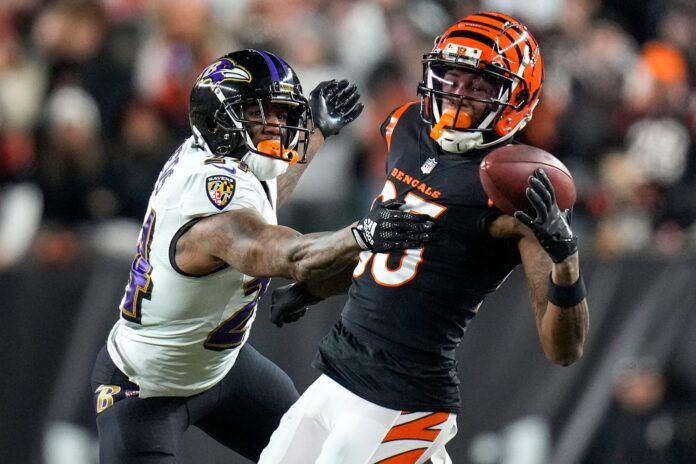 Tee Higgins attempts a catch vs. Baltimore Ravens CB Marcus Peters.