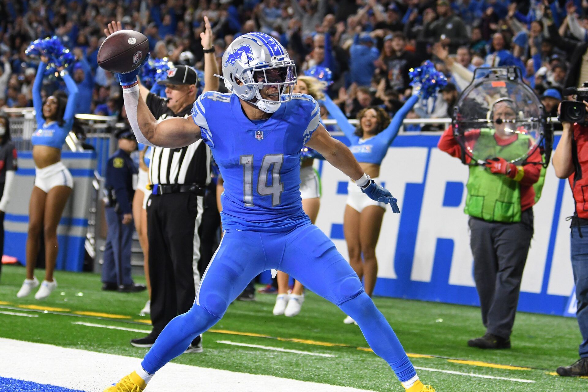 Amon-Ra St. Brown (14) celebrates by throwing the football into the end zone wall after scoring a touchdown on a pass from quarterback Jared Goff (not pictured) against the Jacksonville Jaguars in the fourth quarter at Ford Field.