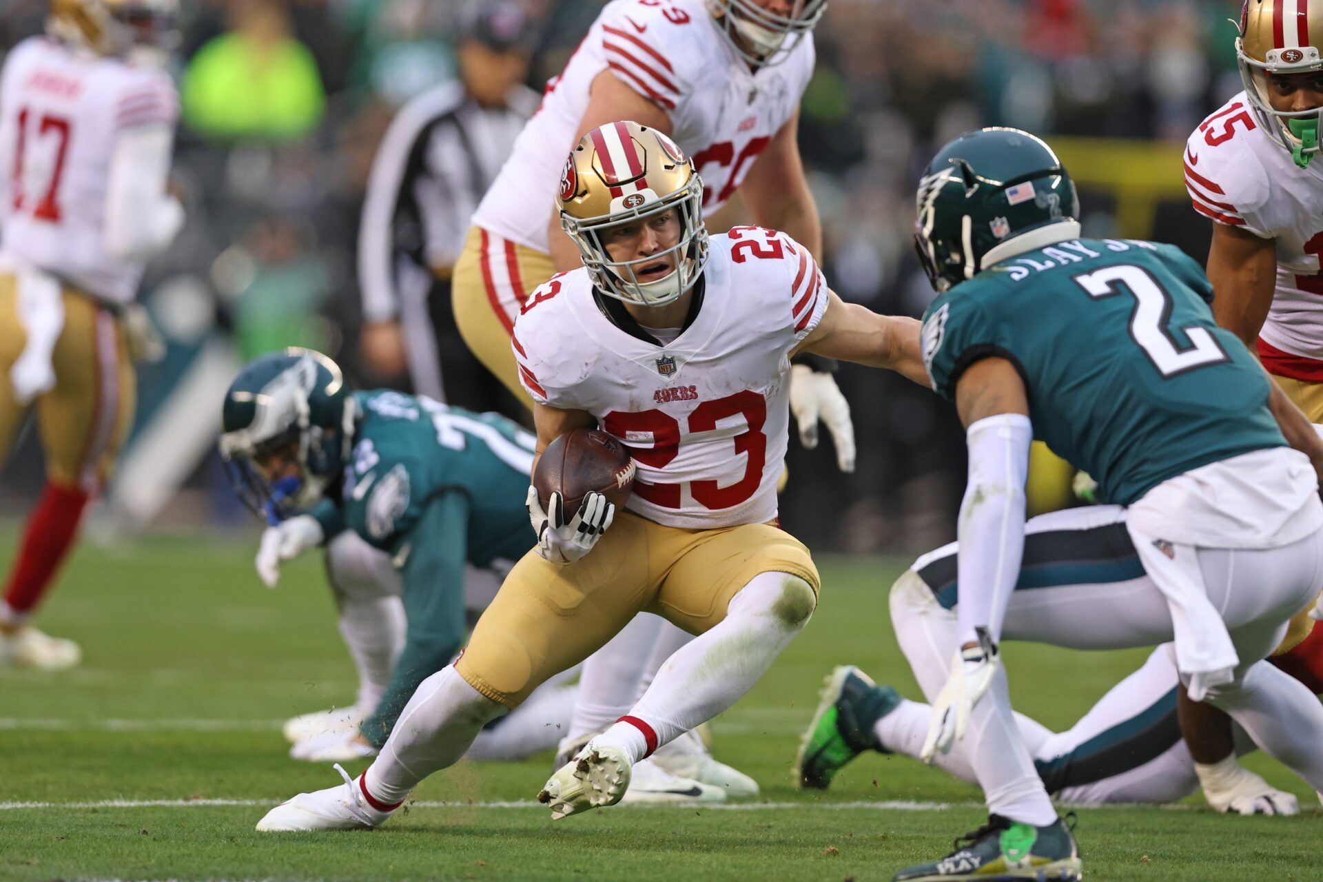 Christian McCaffrey (23) makes a move on Philadelphia Eagles cornerback Darius Slay (2) on way to a 23-yard touchdown run during the second quarter in the NFC Championship Game at Lincoln Financial Field.