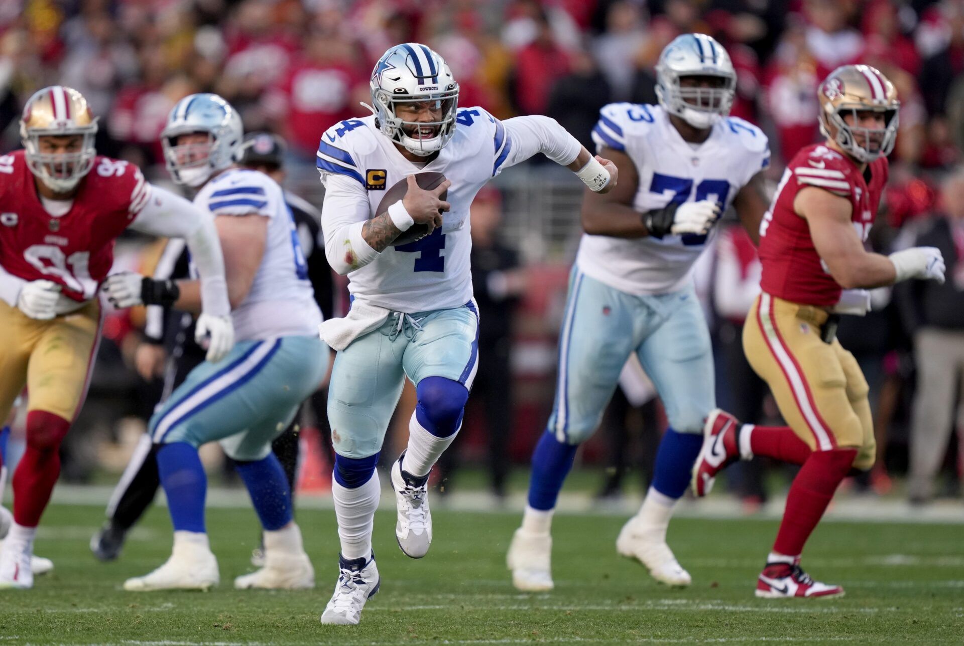 Dallas Cowboys QB Dak Prescott (4) rushes the ball against the 49ers.