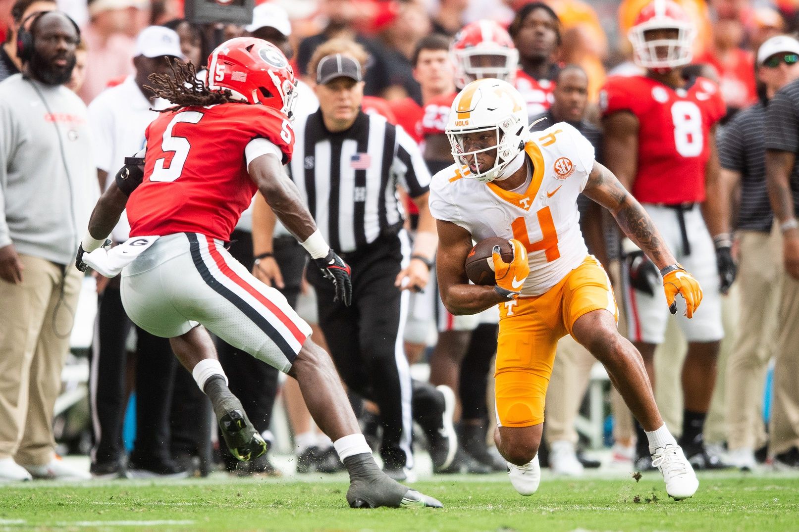 WR Cedric Tillman (4) makes a move on DB Kelee Ringo (5).