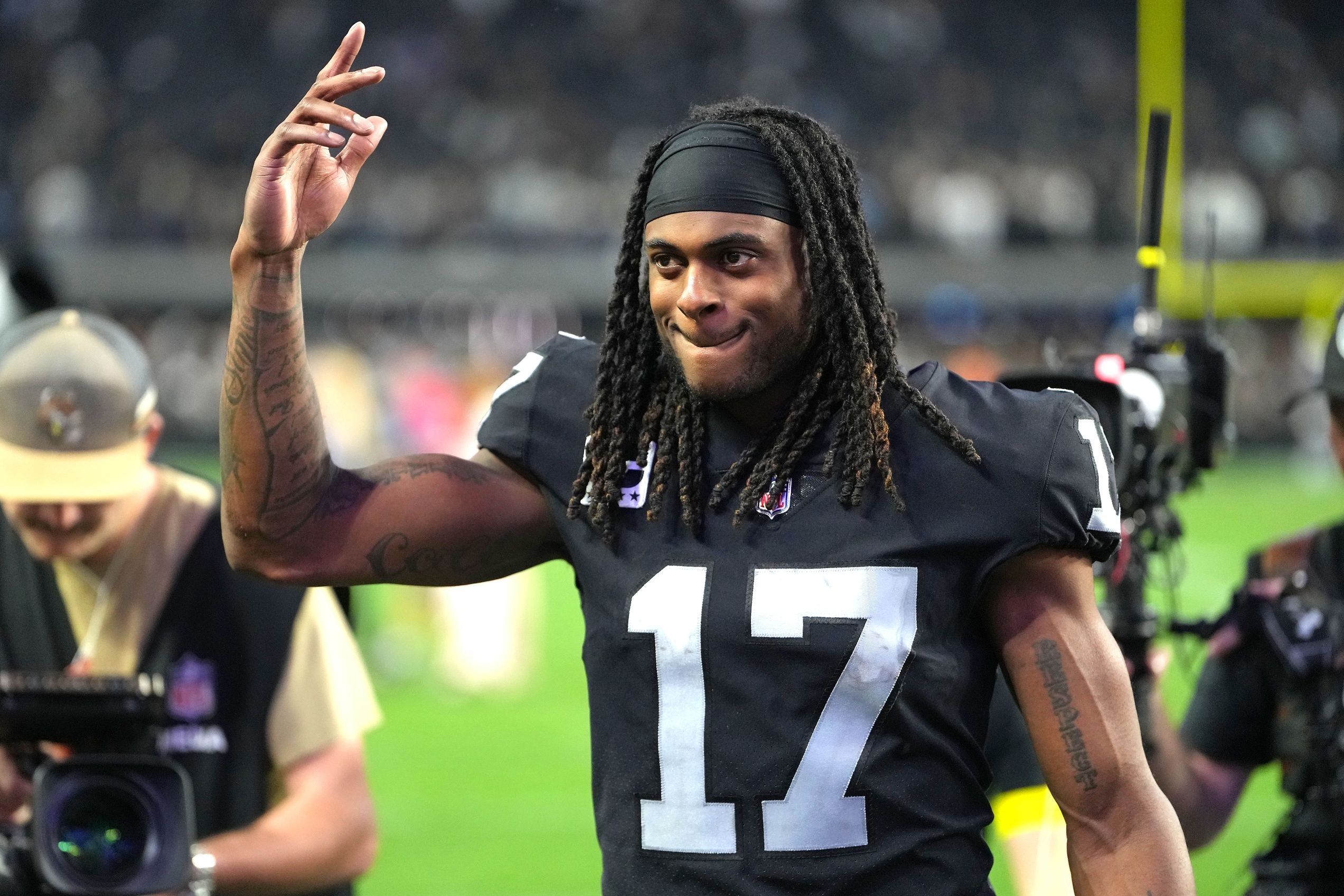 Las Vegas Raiders wide receiver Davante Adams (17) walks off the field after the Raiders defeated the Los Angeles Chargers 27-20 at Allegiant Stadium.