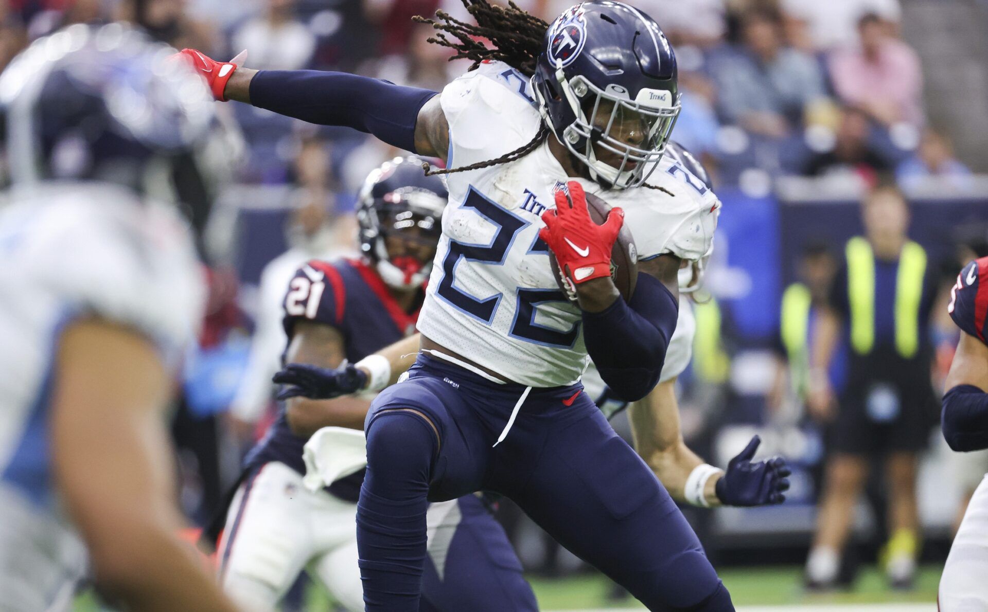 Tennessee Titans RB Derrick Henry (22) rushes the ball against the Houston Texans.