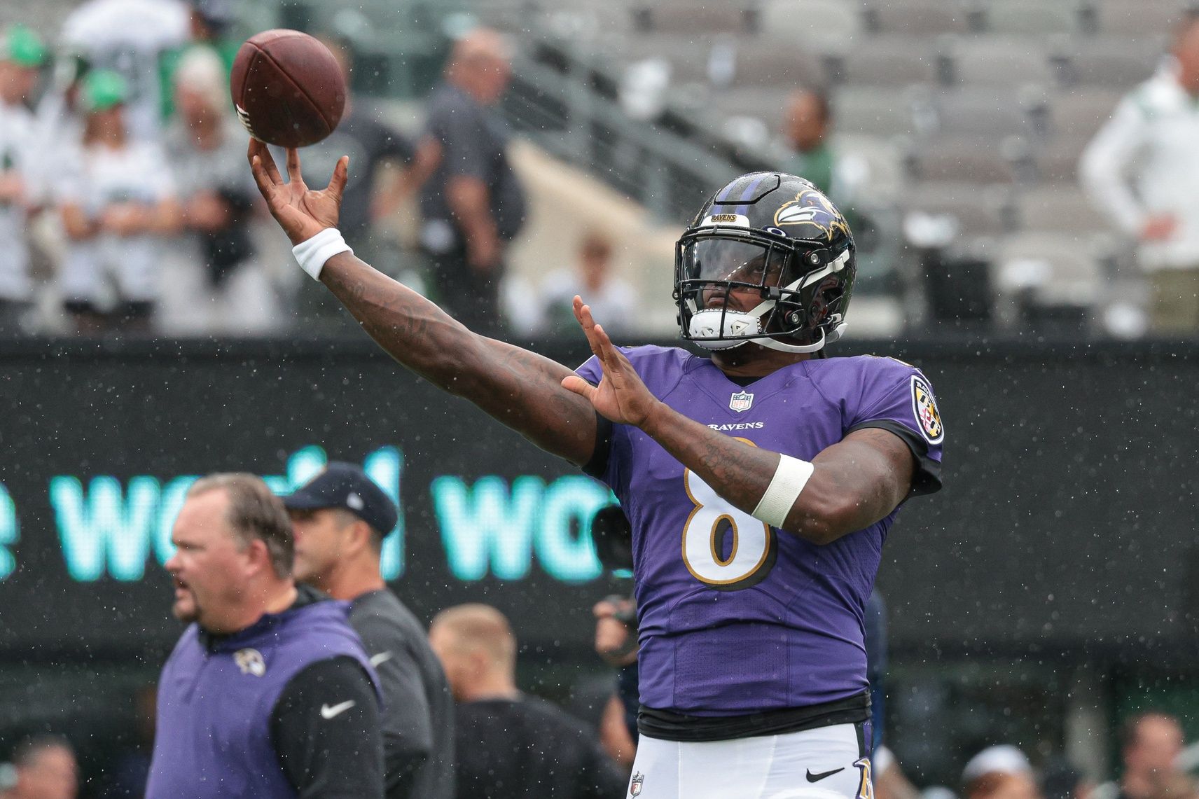 Lamar Jackson (8) throws the ball during warm ups before the game against the New York Jets at MetLife Stadium.