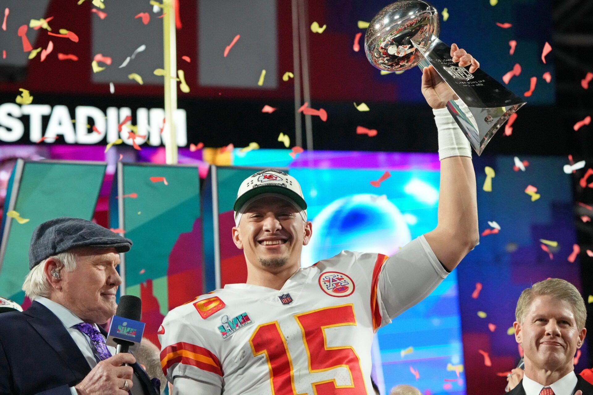 Patrick Mahomes (15) holds the Vince Lombardi Trophy after winning Super Bowl LVII against the Philadelphia Eagles at State Farm Stadium.