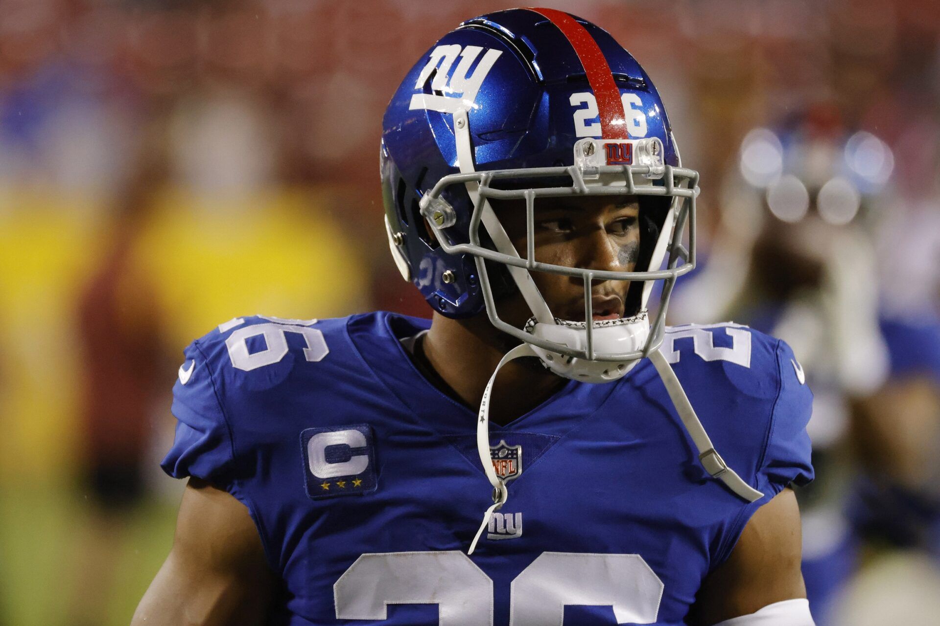 Saquon Barkley (26) stands on the field during warmups prior to the Giants' game against the Washington Football Team at FedExField.