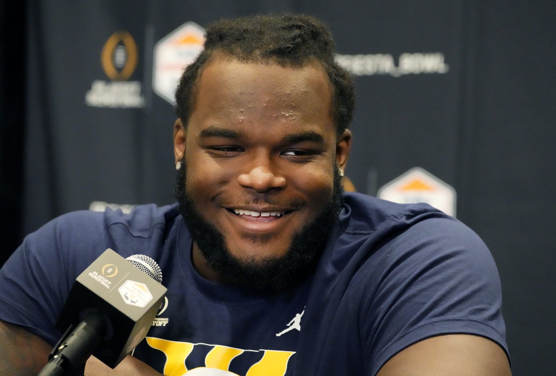 Michigan Wolverines defensive lineman Mazi Smith (58) speaks during Vrbo Fiesta Bowl media day.