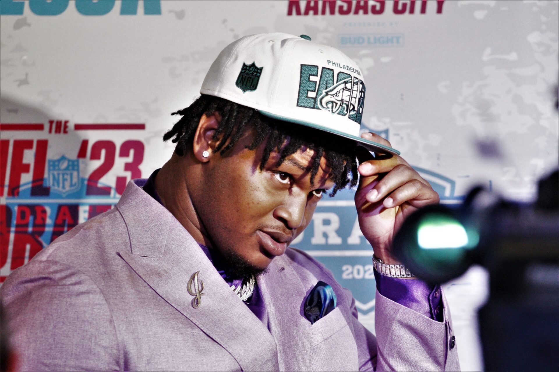 Defensive tackle Jalen Carter poses for pictures with his Philadelphia Eagles hat after the team selected him.