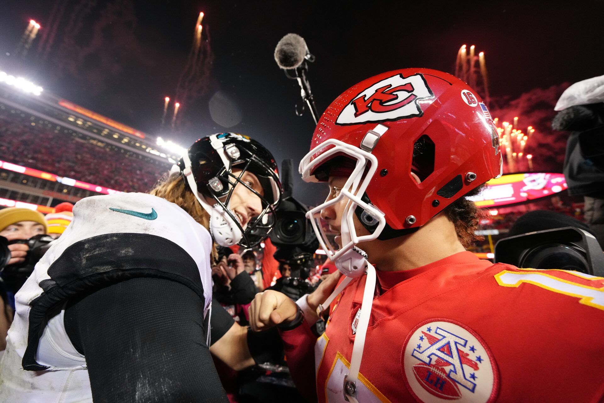 Kansas City Chiefs QB Patrick Mahomes (15) and Jacksonville Jaguars QB Trevor Lawrence (16) meet following the AFC Divisional Round.