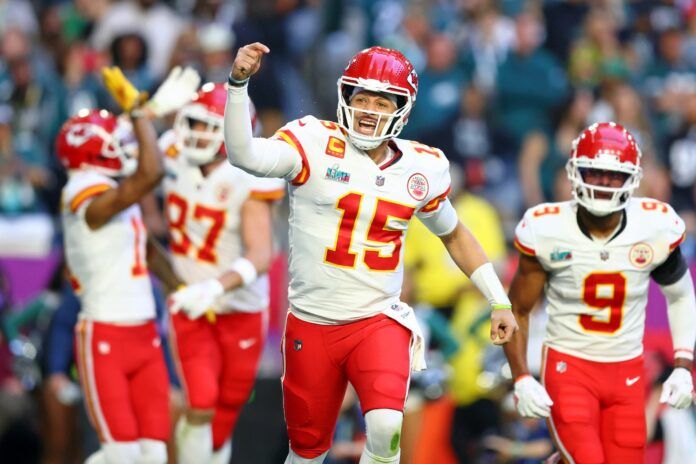 Kansas City Chiefs QB Patrick Mahomes (15) and teammates react after scoring a touchdown against the Eagles in the Super Bowl.