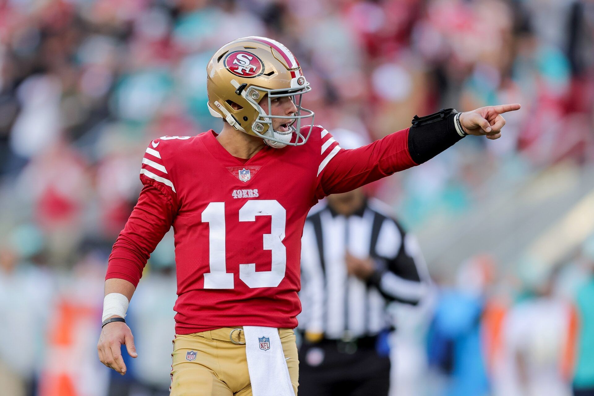 San Francisco 49ers QB Brock Purdy (13) signals during the game against Miami.