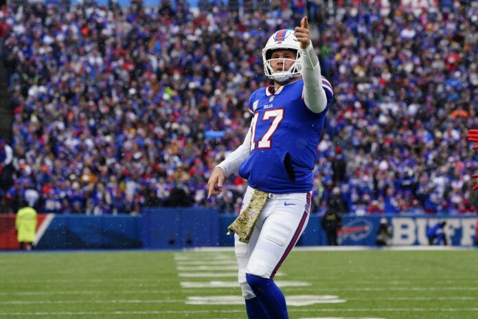 Josh Allen (17) reacts to running for a first down against the Minnesota Vikings during the first half at Highmark Stadium.