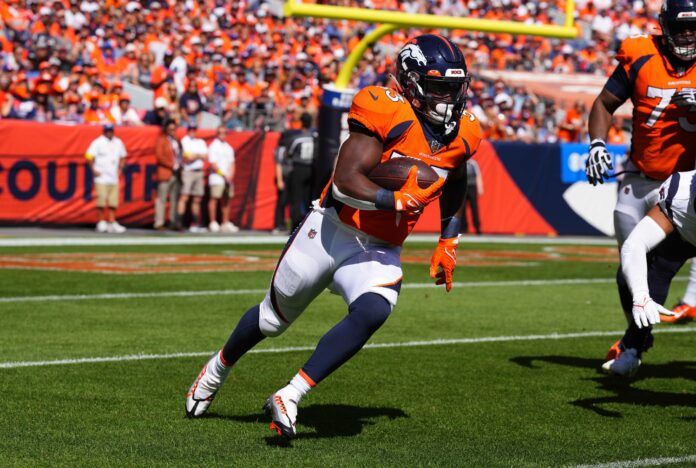 Denver Broncos RB Javonte Williams (33) rushes the ball against Houston.