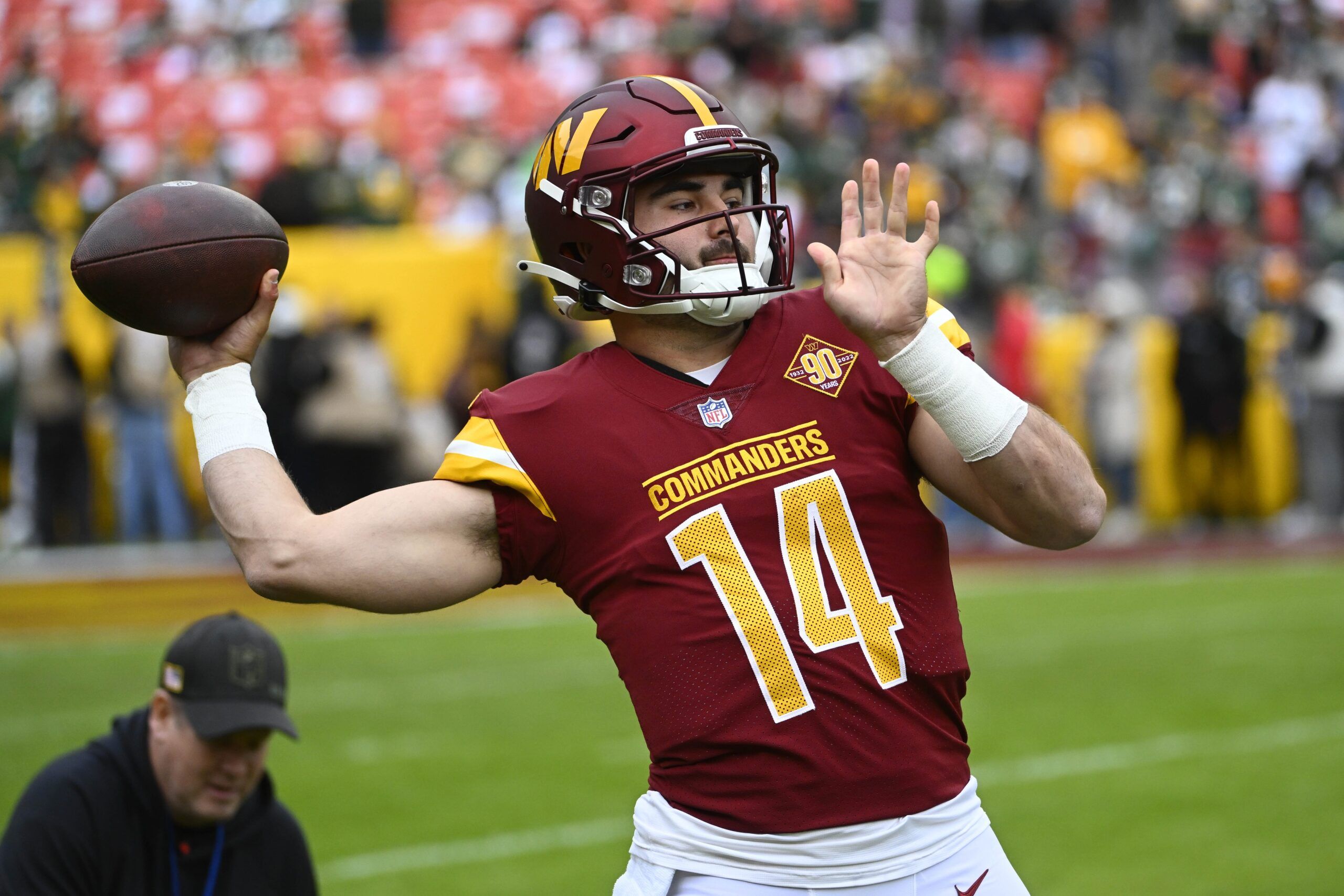 Sam Howell (14) on the field before the game against the Green Bay Packers at FedExField.