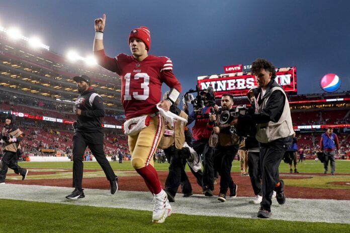 San Francisco 49ers QB Brock Purdy (13) gestures towards the crowd after the team's Wild Card Round victory.