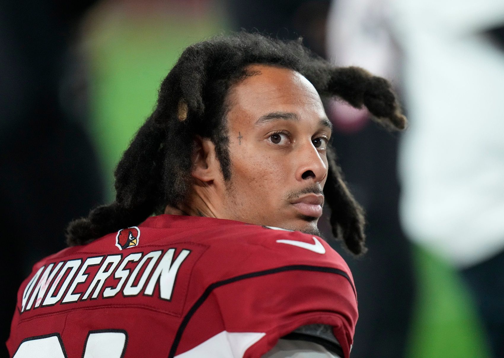 Wide receiver Chosen Anderson watches the game from the sidelines.