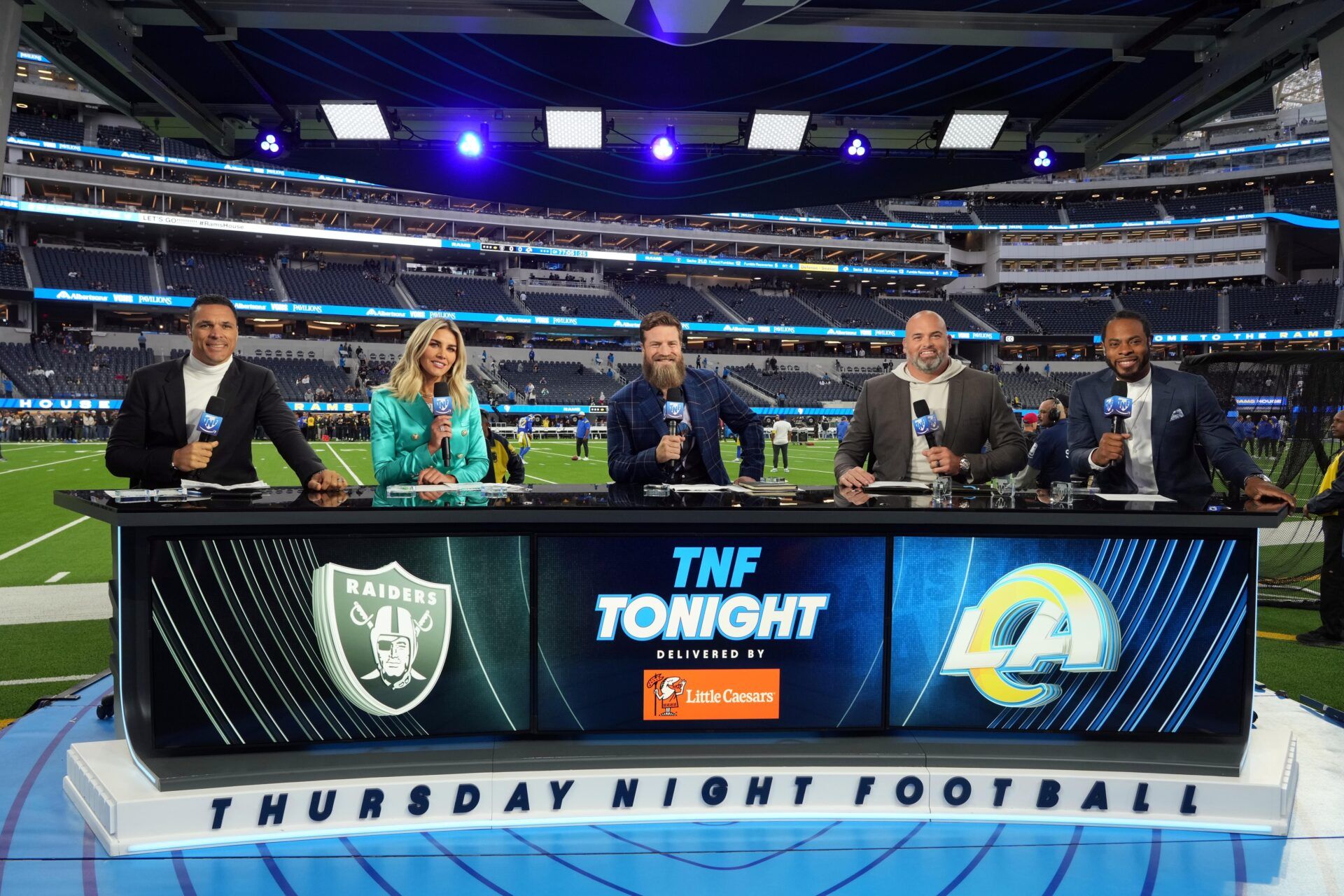 The Thursday Night Football panel takes a picture on set.