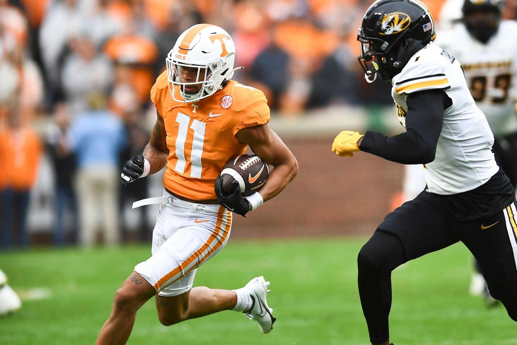 Wide receiver Jalin Hyatt (11) tries to get past a Missouri defender.