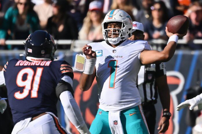 Miami Dolphins QB Tua Tagovailoa (1) throws a pass against Chicago.