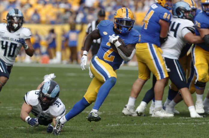 Israel Abanikanda (2) runs on his way to scoring a twenty-four yard touchdown against the Rhode Island Rams.