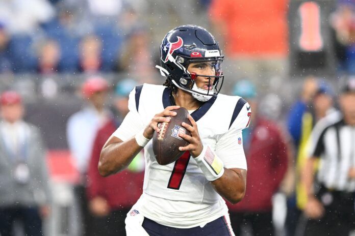 Houston Texans QB C.J. Stroud (7) drops back to pass against the New England Patriots.