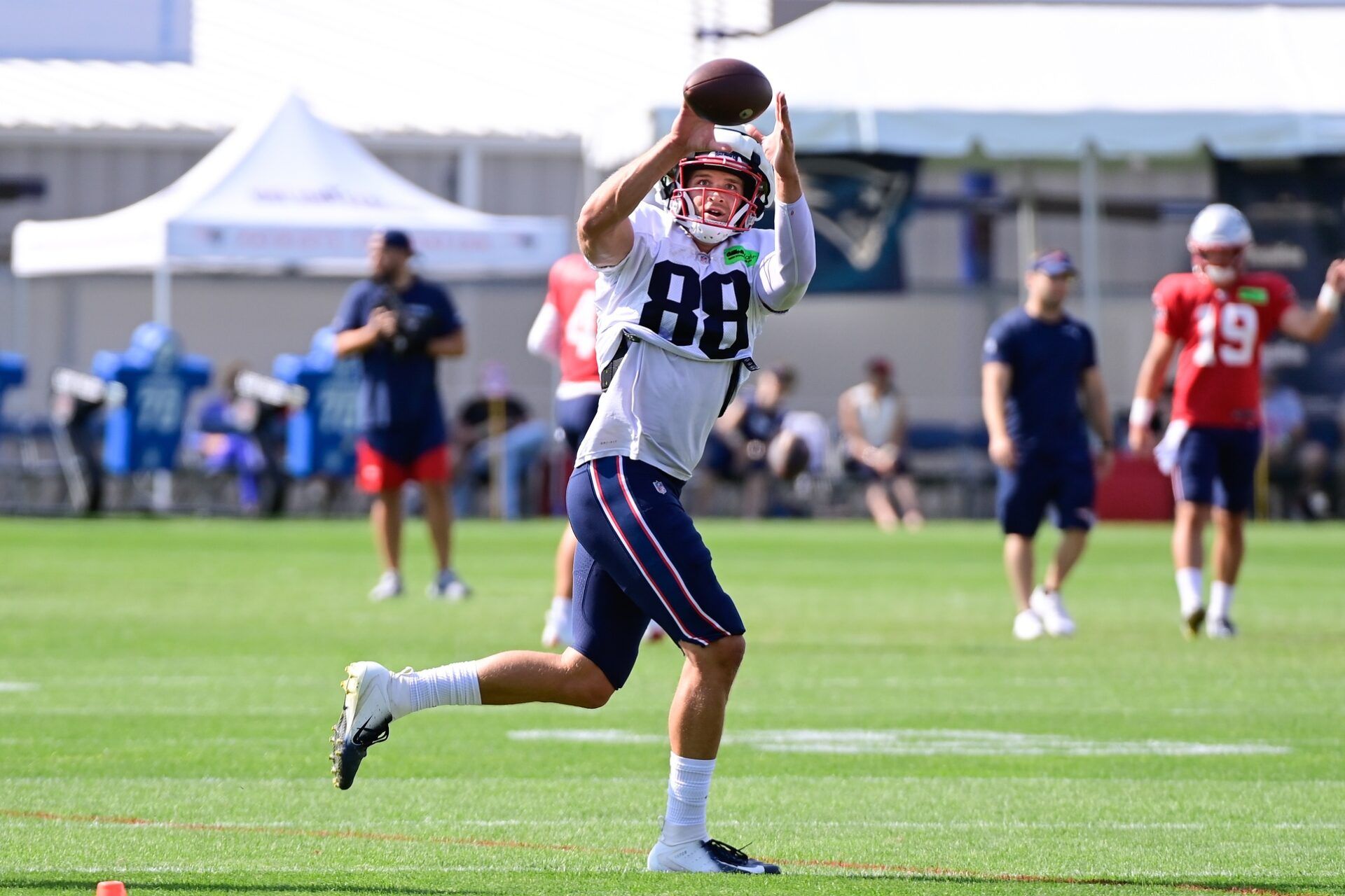 New England Patriots TE Mike Gesicki (88) catches a pass during practice at training camp.