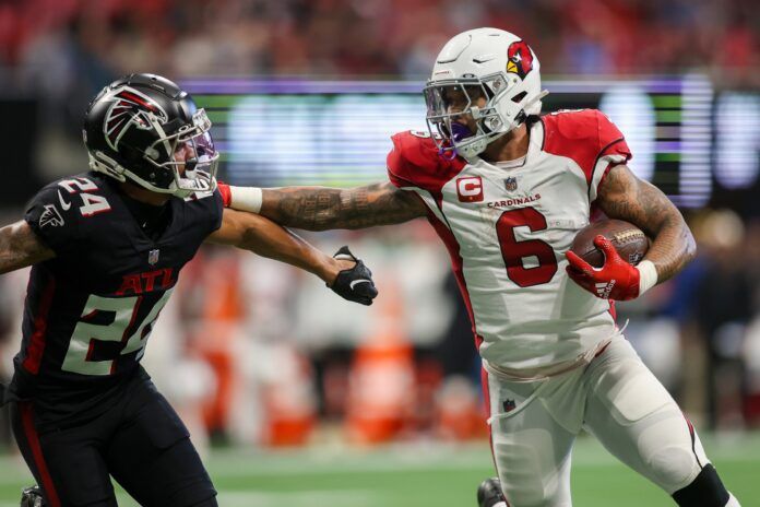 James Conner (6) stiff arms Atlanta Falcons cornerback A.J. Terrell (24) in the first half at Mercedes-Benz Stadium.