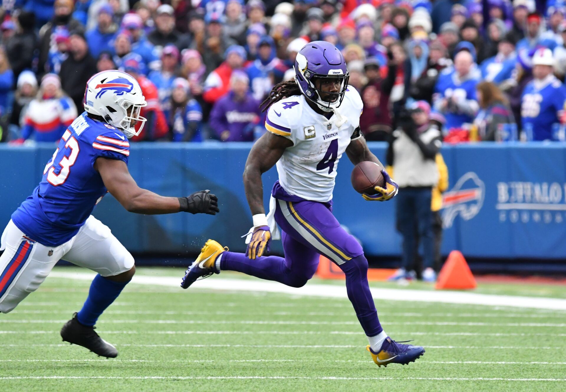 Dalvin Cook (4) outruns Buffalo Bills linebacker Tyrel Dodson (53) in the third quarter at Highmark Stadium.