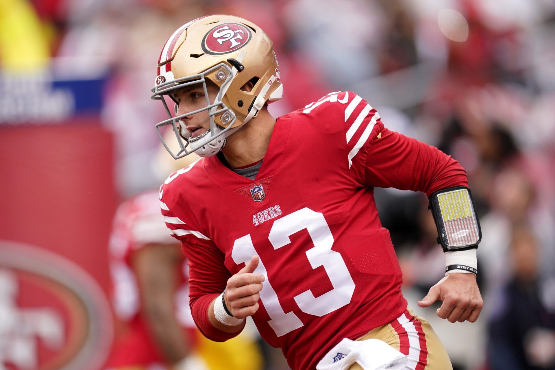 Brock Purdy (13) warms up before a wild card game against the Seattle Seahawks at Levi's Stadium.