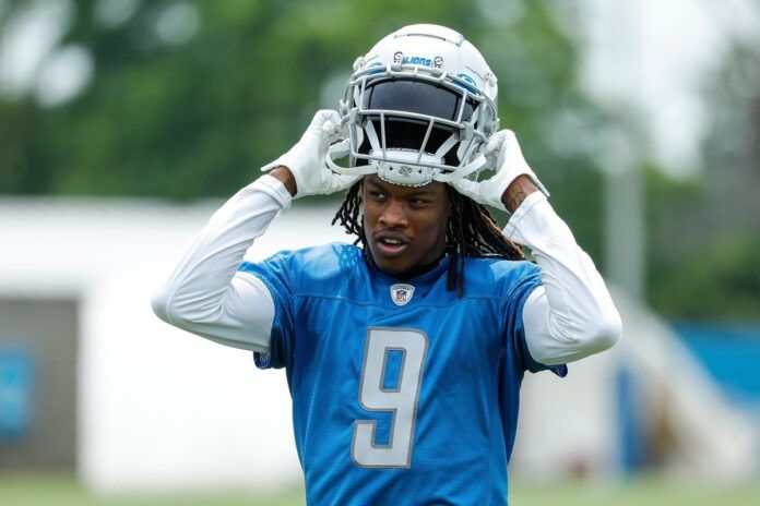 Jameson Williams walks off the field after practice during minicamp at Detroit Lions Headquarters and Training Facility.