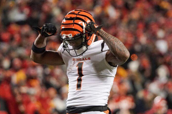 Ja'Marr Chase (1) celebrates against the Kansas City Chiefs after a play during the AFC Championship game at GEHA Field at Arrowhead Stadium.