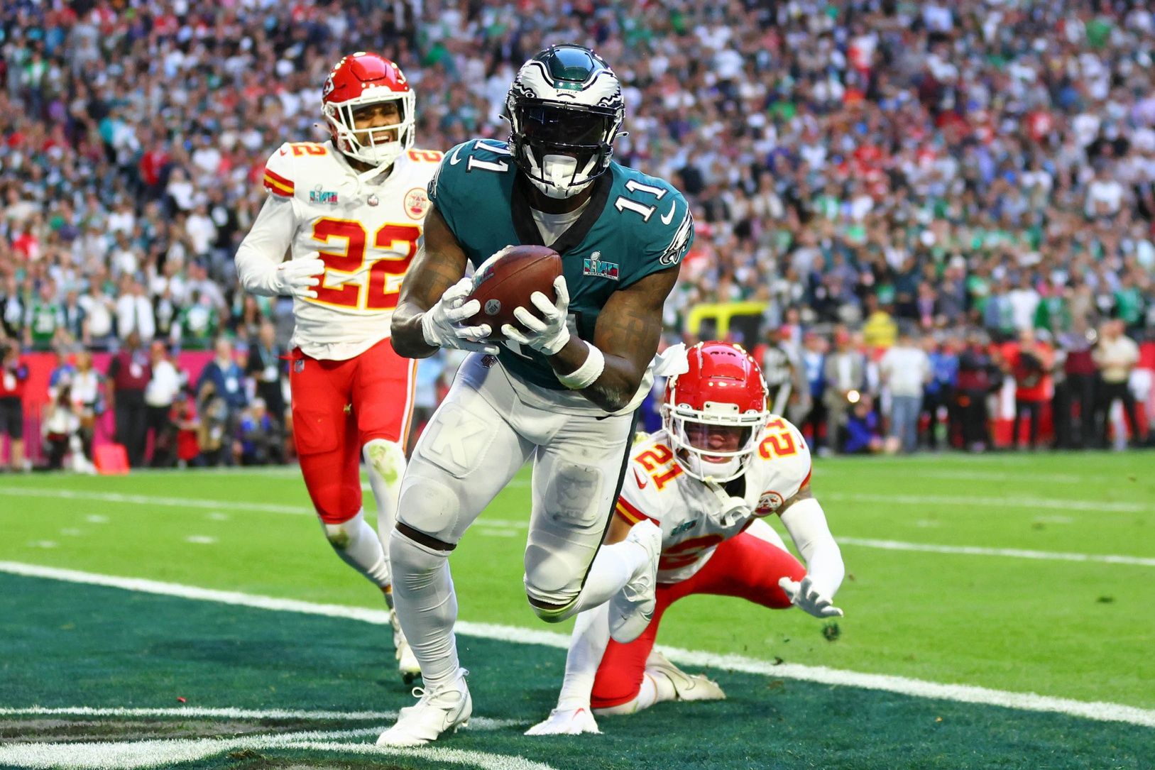 A.J. Brown (11) makes a catch for a touchdown against the Kansas City Chiefs during the second quarter of Super Bowl LVII at State Farm Stadium.