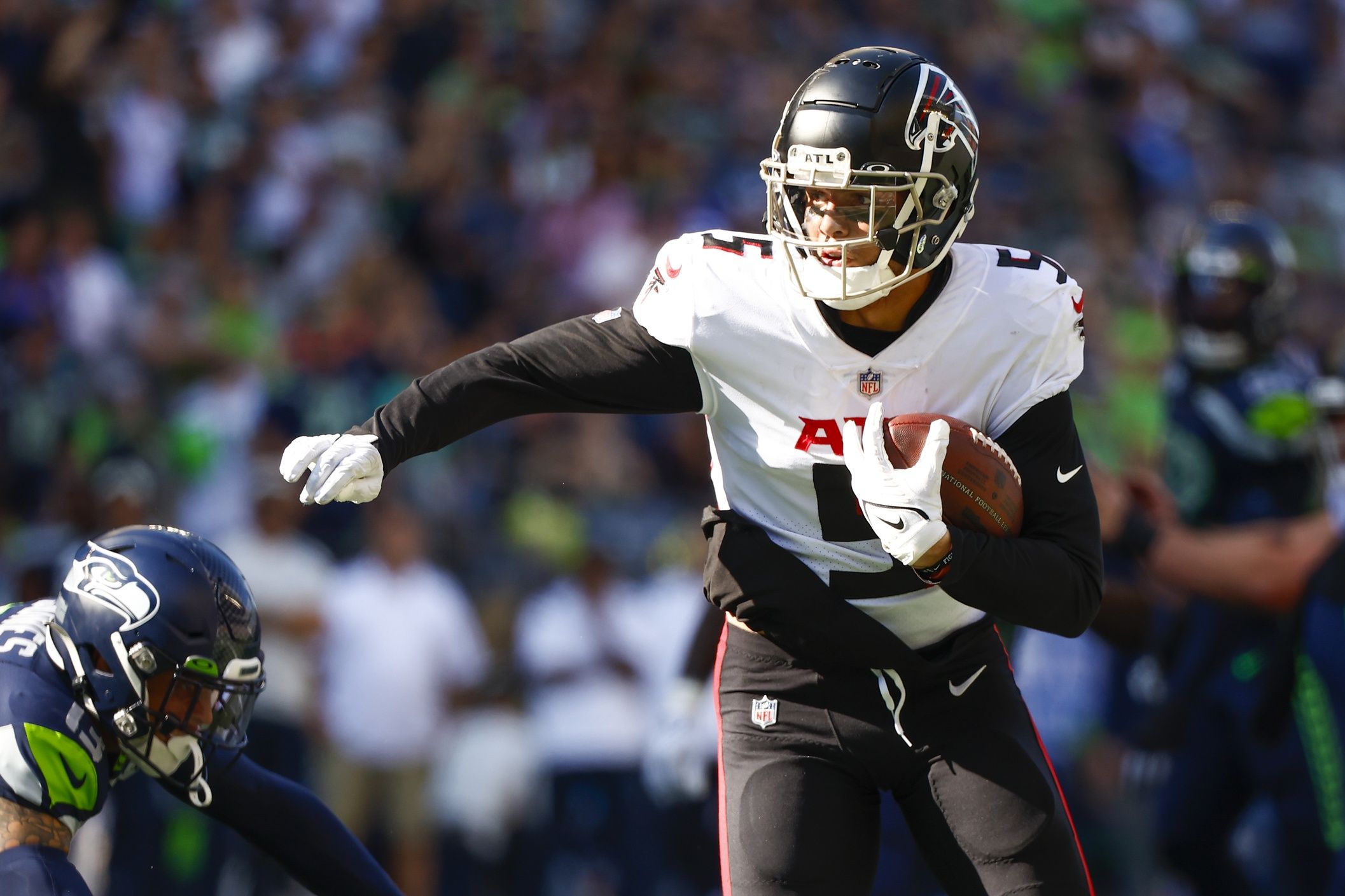 Drake London (5) runs a reception into the end zone for a touchdown against the Seattle Seahawks during the third quarter at Lumen Field.